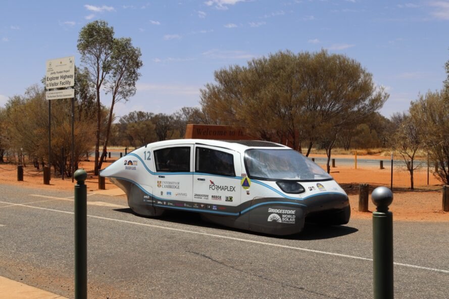 low-lying white electric car